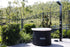 ICEMAN POD portable ice bath set up outdoors next to a shower in a pool area